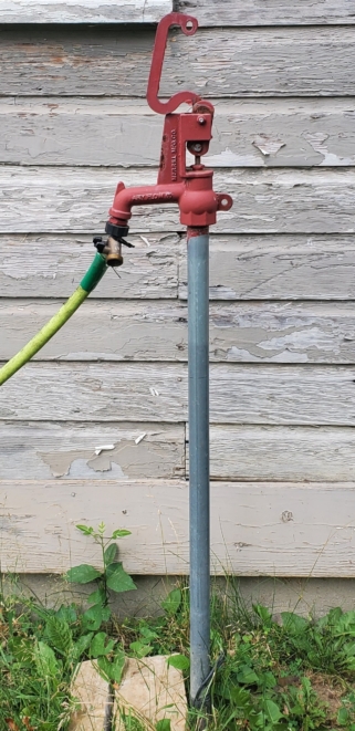 yard hydrant attached to garden hose
